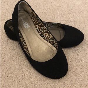 Black flats with cheetah print on the inside